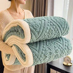 Rolled teal embossed sherpa blanket