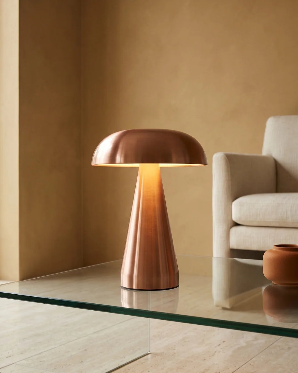 Rose gold lamp on glass table