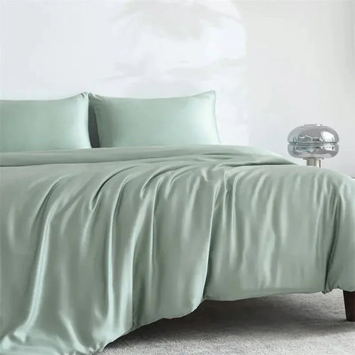 Sage green bamboo sheet set on bed
