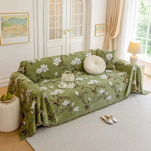 Sage green floral chenille couch cover on sofa