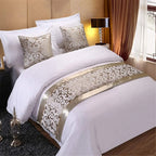 Silver jacquard bed runner on bed