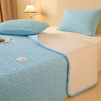 Sky blue coverlet with white reverse