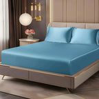 Sky blue satin sheet set on bed