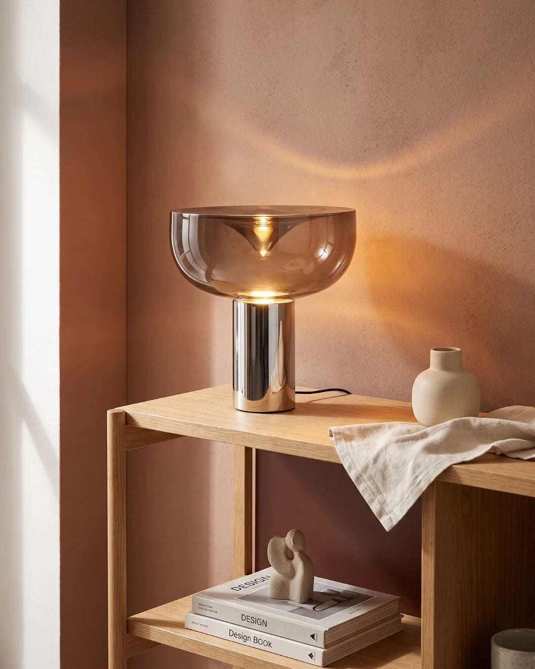 Smoked glass lamp on wooden shelf