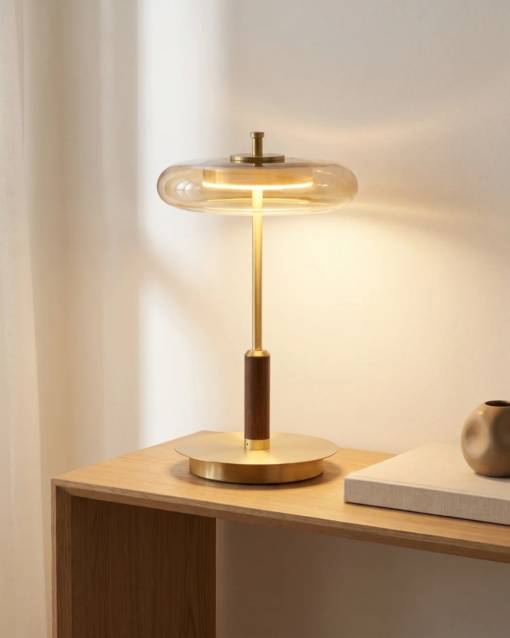 Smoked glass table lamp on desk