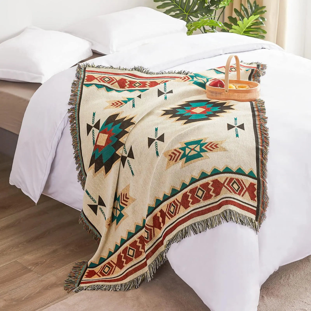 Southwestern throw blanket with fringe on bed