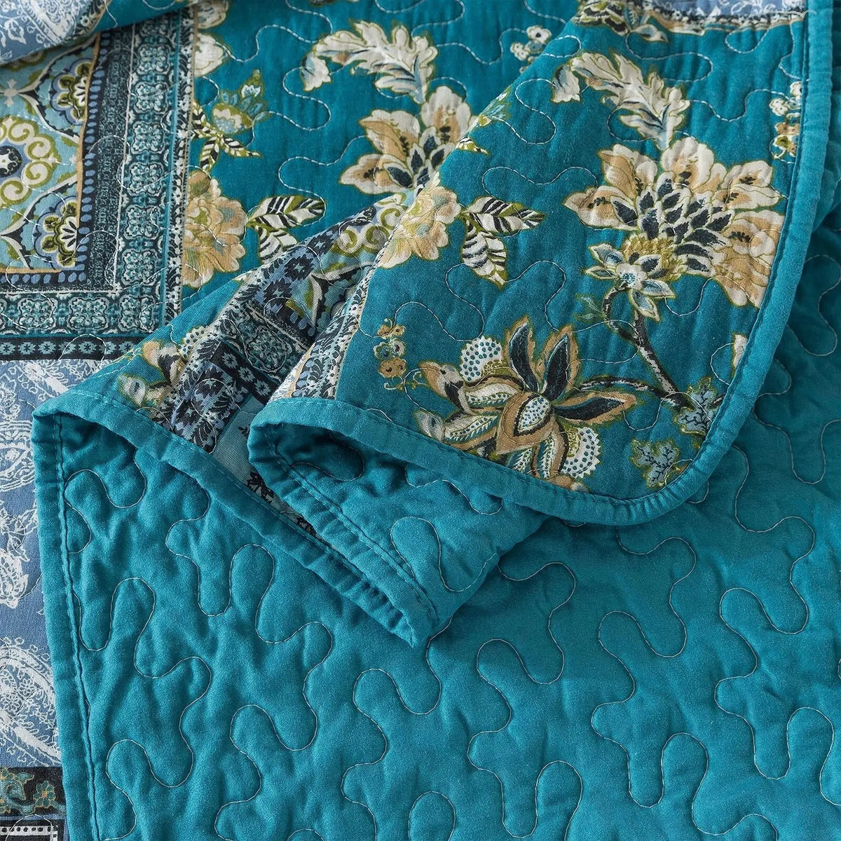 Teal quilted reverse of patchwork bedspread