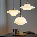 Three glass pendant lights over kitchen counter