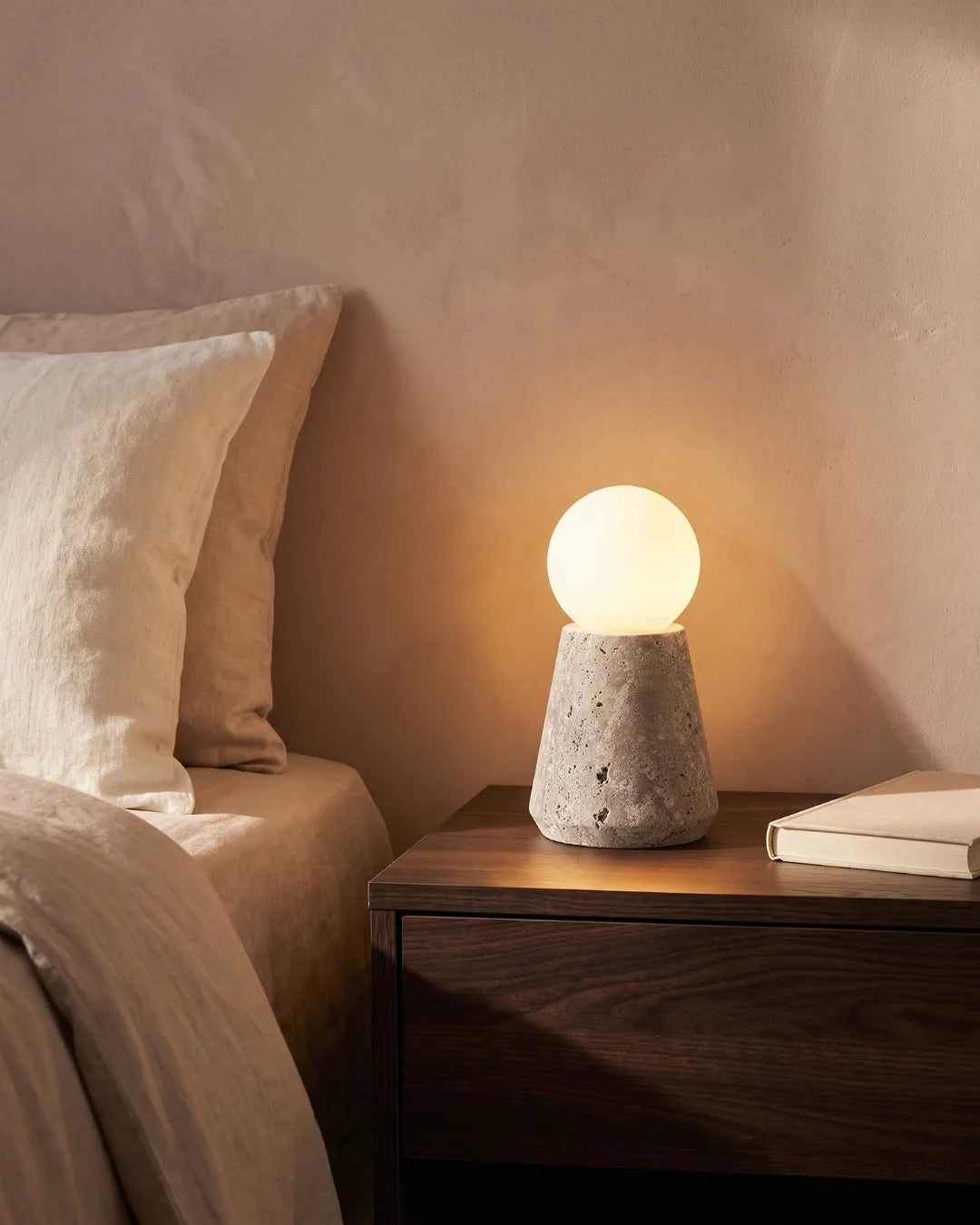 Travertine lamp on nightstand