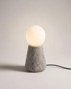 Travertine table lamp with glass globe