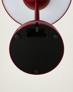 Underside of red cordless lamp