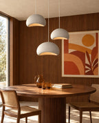 Wabi sabi pendant lights over dining table