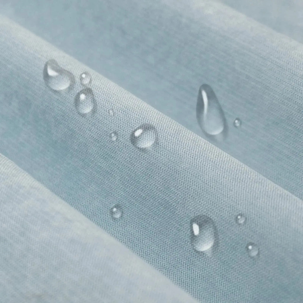 Water droplets beading on waterproof couch cover fabric