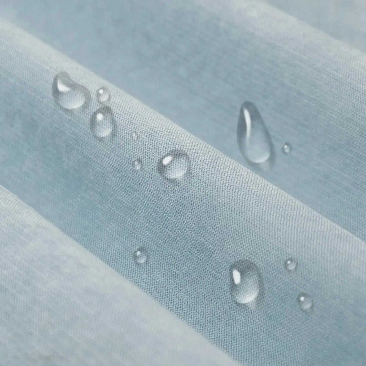 Water droplets beading on waterproof couch cover fabric