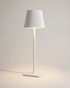 White cordless table lamp with pleated shade