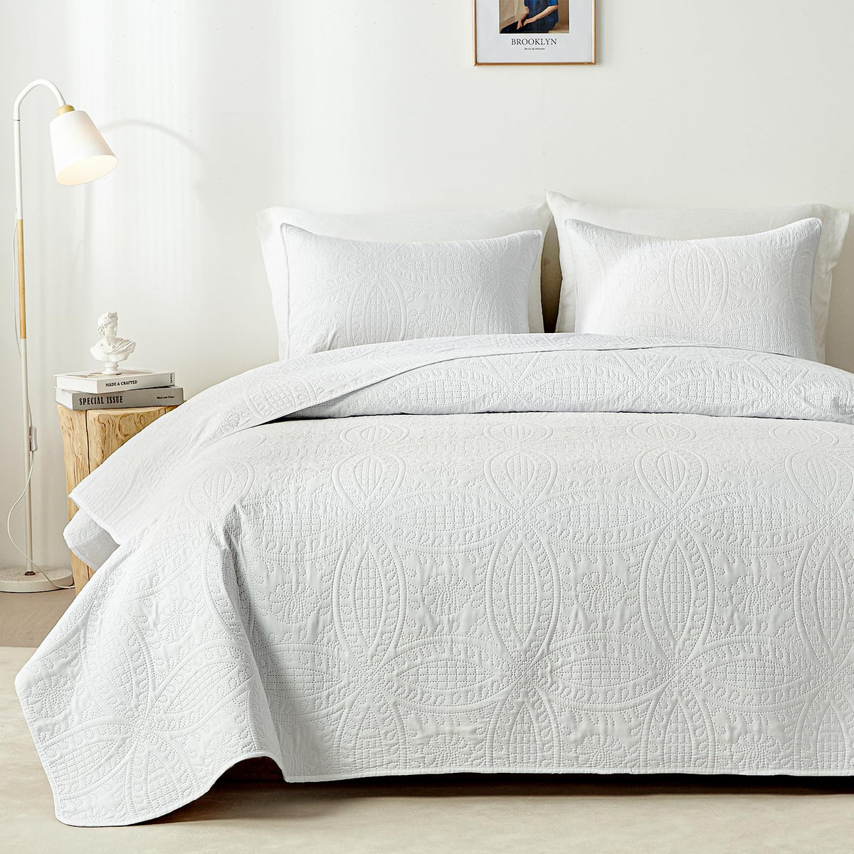 White embossed coverlet in bedroom