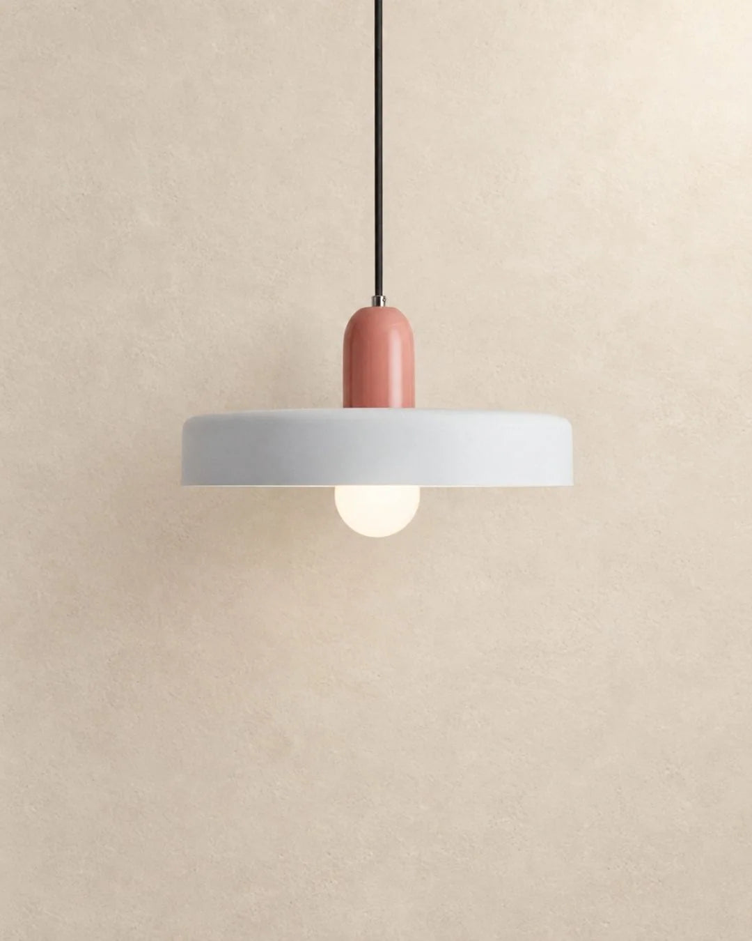 White pendant light with pink holder
