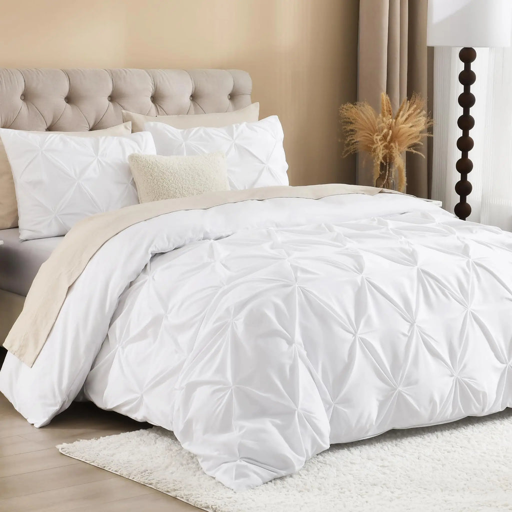 White pinch pleat duvet cover set on bed