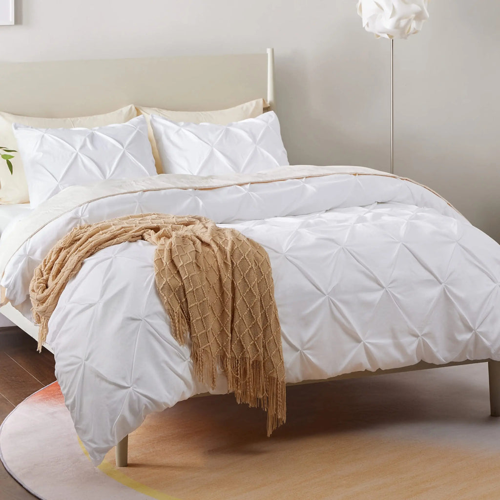 White pinch pleat duvet cover with knit throw