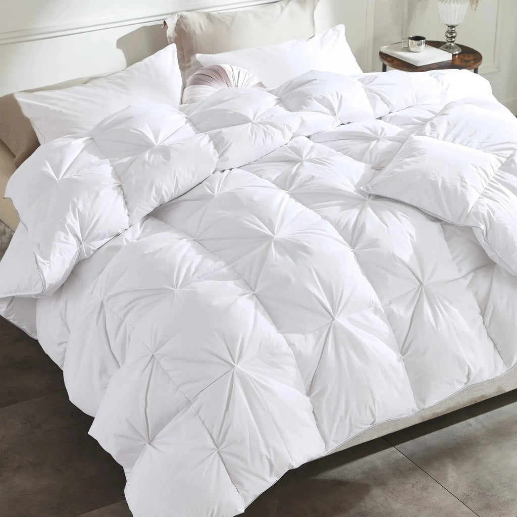 White pinch pleat goose down comforter on bed