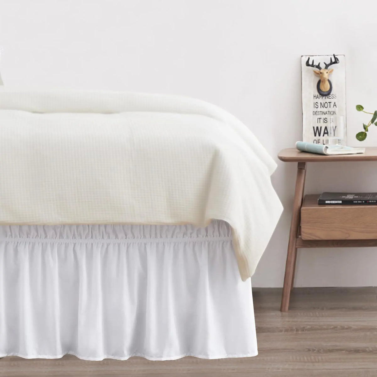 White ruffled dust ruffle on bed