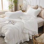 White seersucker ruffle bedding set on bed