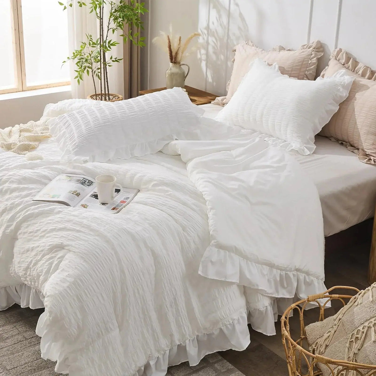 White seersucker ruffle bedding set on bed