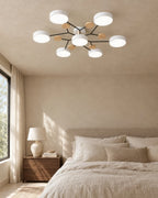 White sputnik ceiling light in bedroom