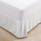 White tailored bed skirt corner