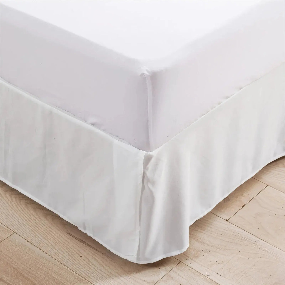 White tailored bed skirt corner