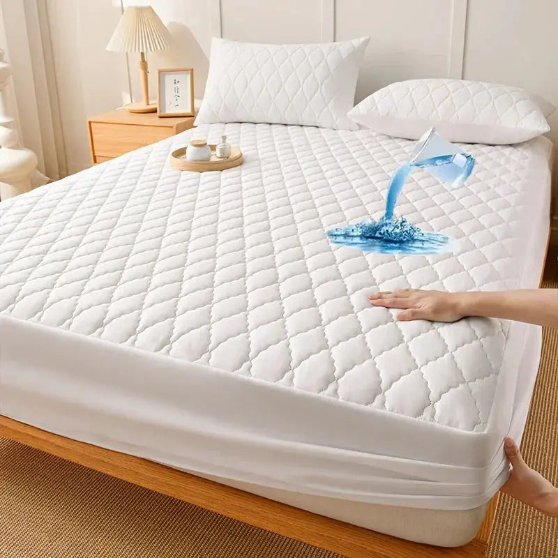 White waterproof mattress pad repelling spilled water