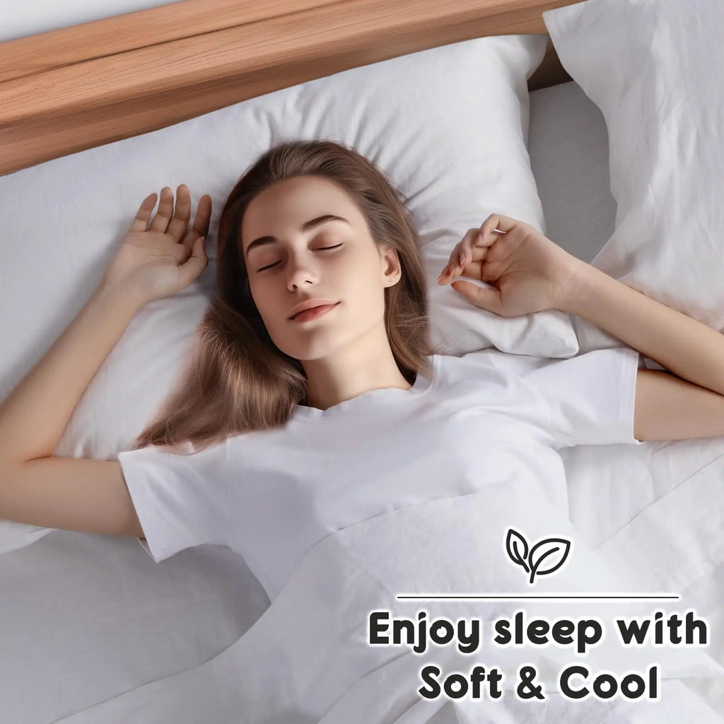 Woman sleeping on soft white linen sheets