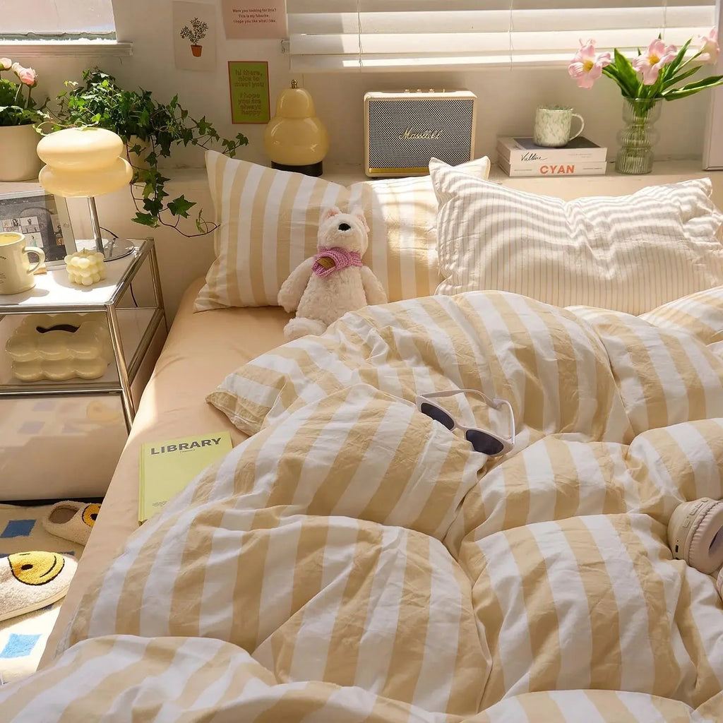 Yellow and white striped quilt set in bedroom