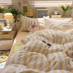 Yellow and white striped quilt set in bedroom