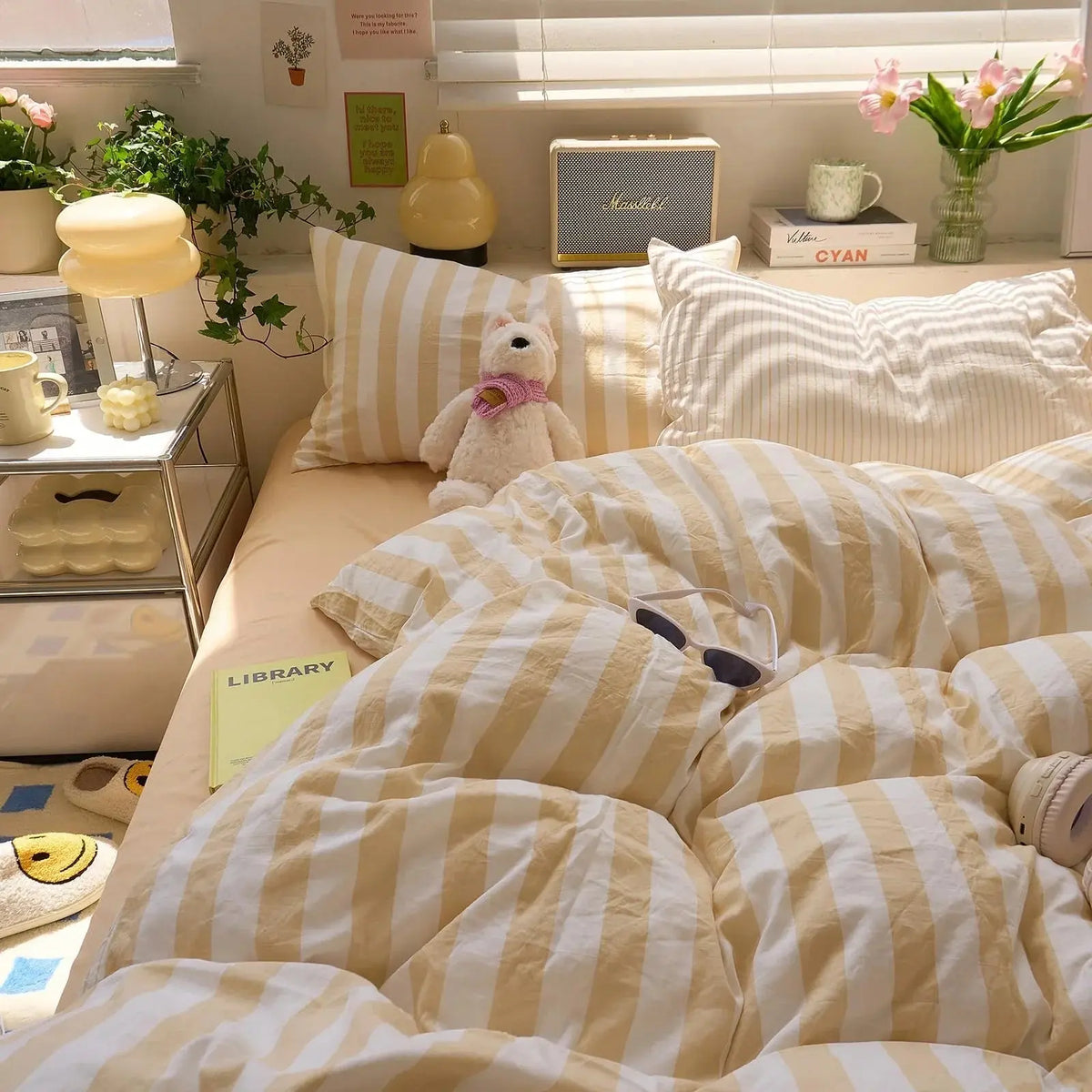 Yellow and white striped quilt set in bedroom