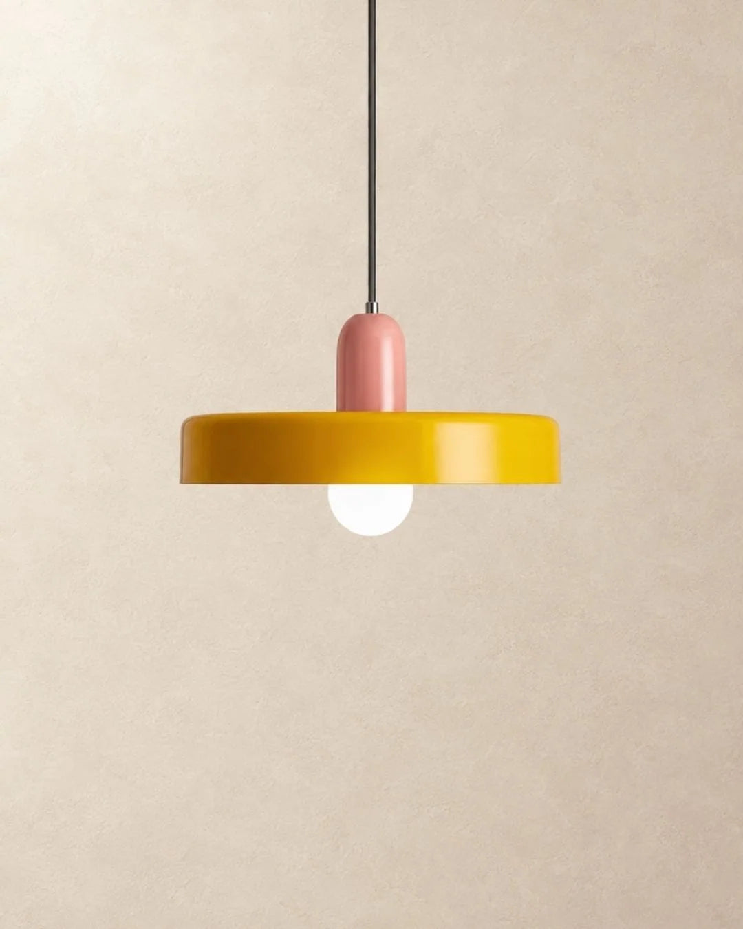 Yellow pendant light with pink holder