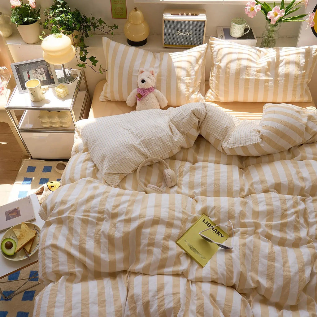Yellow striped washed cotton quilt set on bed