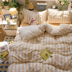 Yellow striped washed cotton quilt set on bed
